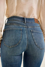 Blue denim judy blue flare jeans with high waist tummy control and brown leather brand patch on waistband