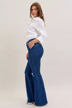 Blue denim high waist flare jeans by judy blue with front patch pockets and subtle stitching details