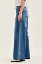 Back view of blue denim judy blue high waist palazzo jeans with a heart shaped logo on the back pocket