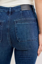 Dark blue denim judy blue high-waisted flare jeans featuring a black leather brand patch at the waistband