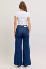 Back view of Judy Blue high-waisted blue denim retro wide jeans with classic patch pockets and twisted seams
