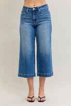 Judy Blue mid rise crop wide leg jeans in medium-wash blue denim with straight leg cut and rolled cuffs