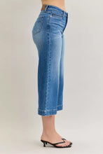 Blue denim judy blue mid rise crop wide leg jeans featuring classic five-pocket design and rolled cuffs