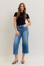 Judy Blue mid rise crop wide leg jeans in blue denim with high waist and rolled cuffs