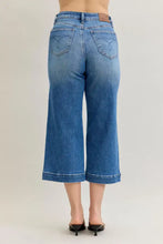 Blue denim culottes with classic wash and brown leather patch featuring judy blue mid rise crop wide leg design