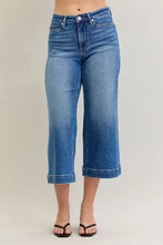High-waisted blue denim cropped pants with classic five-pocket design and rolled cuffs judy blue mid rise style