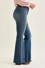 Judy Blue mid rise blue denim flare jeans with classic five-pocket design and frayed hem front flap pockets