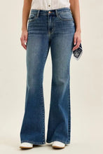 High-waisted blue denim jaqueline flare jeans with triple needle back pockets and subtle fading for a worn-in look