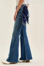 Blue denim jaqueline flare jeans with triple needle back pockets and navy bandana tied at the waist