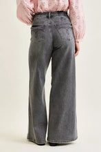 Gray wide-leg denim palazzo pants with faded wash and embroidered back pockets viewed from the back side