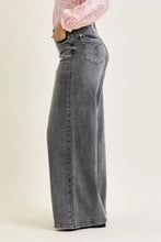Back view of wide-leg gray denim palazzo pants with classic levi’s logo back pocket and split back yoke design