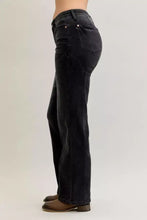 Black denim jeans with a straight-leg cut and subtle fading at the thighs.