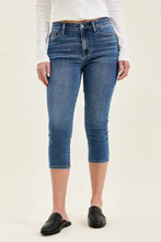 Judy Blue mid-rise stretch capri jeans in medium-wash blue denim with classic stitching and button fly closure