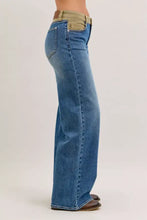 Back view of judy blue column straight jeans in blue denim with tan corduroy waistband and back pocket detailing
