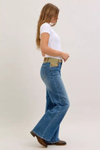 Blue denim judy blue column straight jeans with corduroy waist and tan belt showcasing flare design