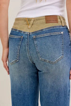 Blue denim judy blue column straight jeans with tan corduroy waistband and brown leather brand patch on the back
