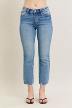 Judy Blue mid-rise vintage wash destroy kick flare jeans in medium-wash blue denim with frayed hems and distressing