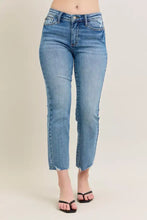 Mid-rise straight-leg denim jeans in light blue with frayed hems featuring vintage wash destroy kick flare design