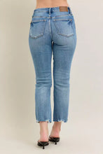 Light-wash denim jeans with vintage wash destroy, straight-leg cut, and frayed hem from Judy Blue kick flare collection