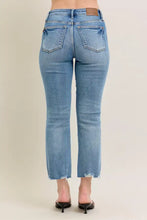 Light-wash denim jeans with a straight-leg cut and frayed hem from judy blue vintage wash destroy kick flare collection