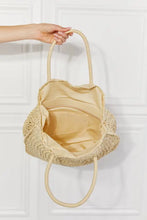 Justin Taylor Beach straw rattan handbag with beige woven tote and circular handles