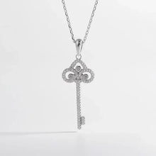 Key shape necklace with diamond-encrusted sterling silver pendant and chain