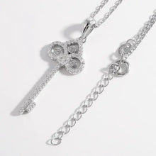 Silver key shape necklace with sterling silver chain and gemstones