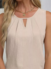 Beige keyhole neck tank top with sleeveless design and pleated detail perfect for casual and formal wear