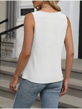 White keyhole neck tank top with subtle textured fabric sleeveless design and rounded neckline for casual wear