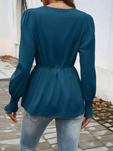 Teal knot front lantern sleeve blouse with gathered waist and ruffled cuffs in lightweight fabric for stylish wear