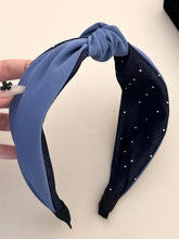 Knotted polyester wide headband in periwinkle blue and navy polka dots