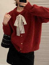 Cozy Lace Bowknot Knit Cardigan with white bow and hearts, slightly stretchy