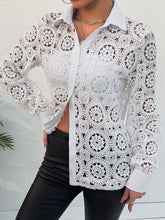 White lace long sleeve shirt with intricate circular patterns and lace button closure on front