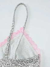 A delicate pink lace detail leopard cami with ruched bodice and gray and white leopard print straps