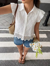White lace button-up blouse with ruffled sleeves and scalloped hem featuring delicate lace details