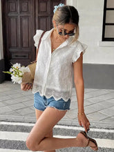 White lace button-up blouse featuring ruffled sleeves and a scalloped hem in an elegant lace detail design