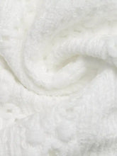 White textured fabric with soft plush appearance on lace detail ruffle sleeve button up shirt