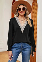 Black long-sleeved lace detail V-neck blouse with lantern sleeves