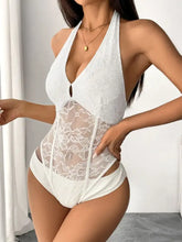 White lace halter neck bodysuit with plunging neckline and corset-style front panel in a one-piece swimsuit design