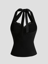 Black satin lace halter neck cami with lace trim and tied bow at the back side showing halter neck cami design