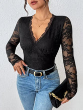 Black lace long sleeve bodysuit with deep v-neckline and floral pattern perfect for elegant evening wear