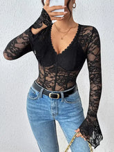 Black lace long sleeve bodysuit featuring floral pattern and corset-style front for elegant wear