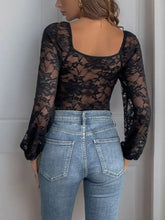 Black lace long sleeve bodysuit with sheer floral pattern and square neckline for elegant layering and styling