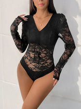 Black lace long sleeve bodysuit with v neck featuring intricate floral patterns and tied waist detail