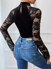 Black lace mock neck long-sleeved bodysuit with velvet bodice and sparkling details