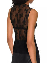 Black floral lace mock neck top with sheer high-neck design and solid black fabric at the bottom