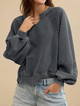 Dark gray lace patchwork mineral wash sweatshirt with intricate trim on raglan sleeves machine wash tumble dry low