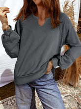 Gray long-sleeved mineral wash sweatshirt with lace patchwork detail on shoulders and cuffs, machine wash, tumble dry low