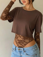 Brown lace patchwork round neck bodysuit with sheer floral pattern long sleeves and ruffled cuffs crop top style