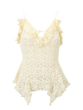 A delicate cream-colored lace ruffle trim tie-front cami with ruffled straps and a peplum hem
